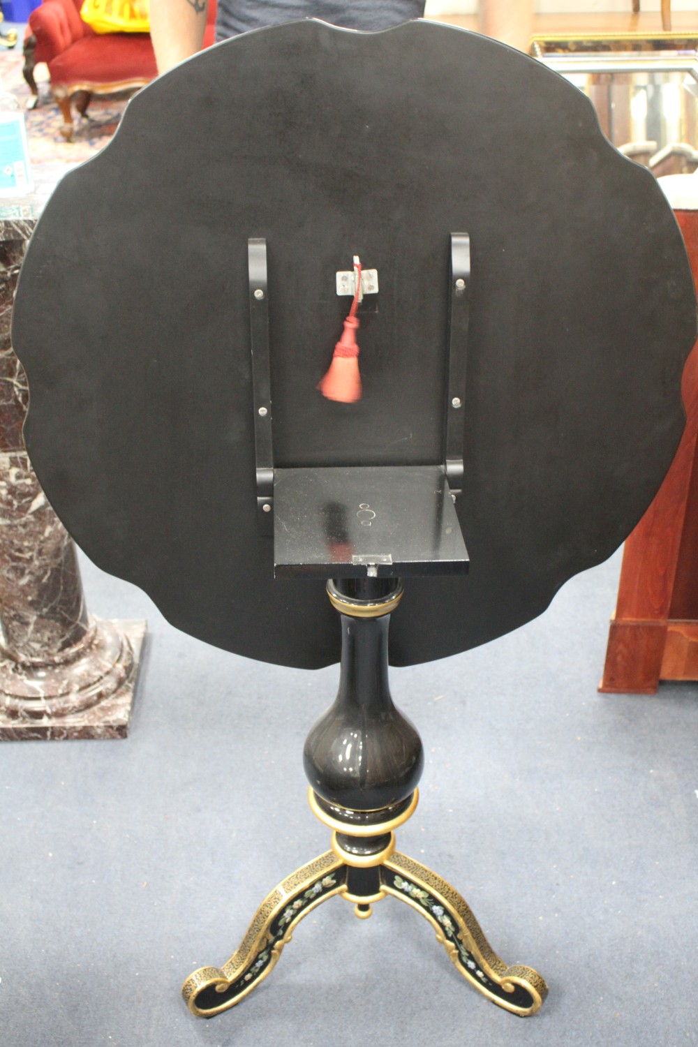 A Meuble Francais floral painted ebonised tripod table, with gilt decoration, W.80cm H.70cm